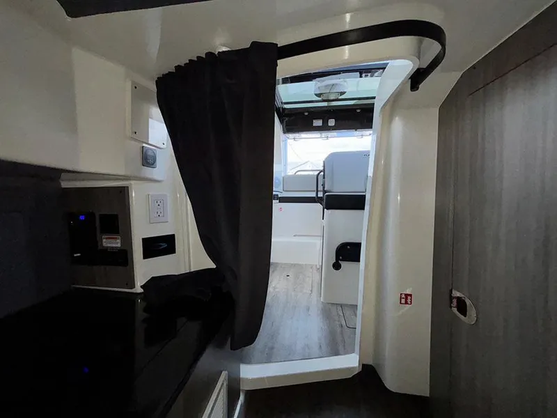 Slide: The Image of Interior of 2025 Navan C30, featuring modern design with curtain and sleek finishes. - 36