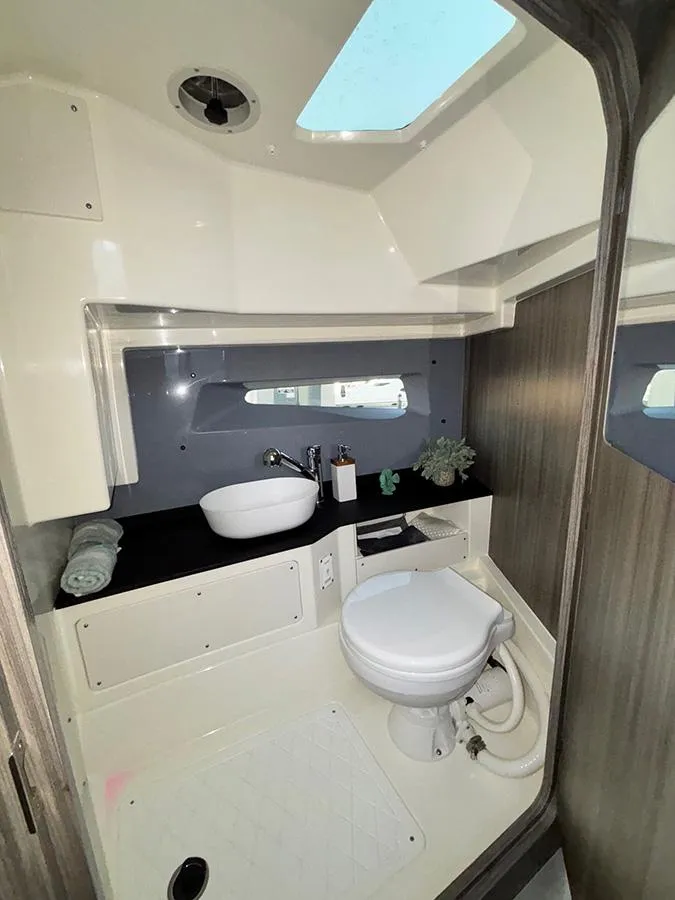 Slide: The Image of Modern bathroom in 2025 Navan C30 boat with skylight, sink, and toilet. - 39