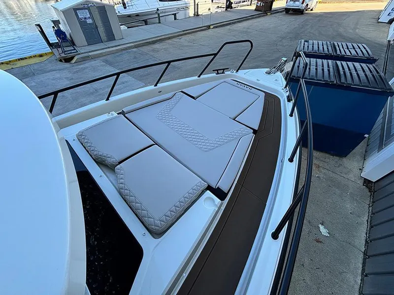 Slide: The Image of 2025 Navan C30 boat with cushioned deck, docked at marina. - 41