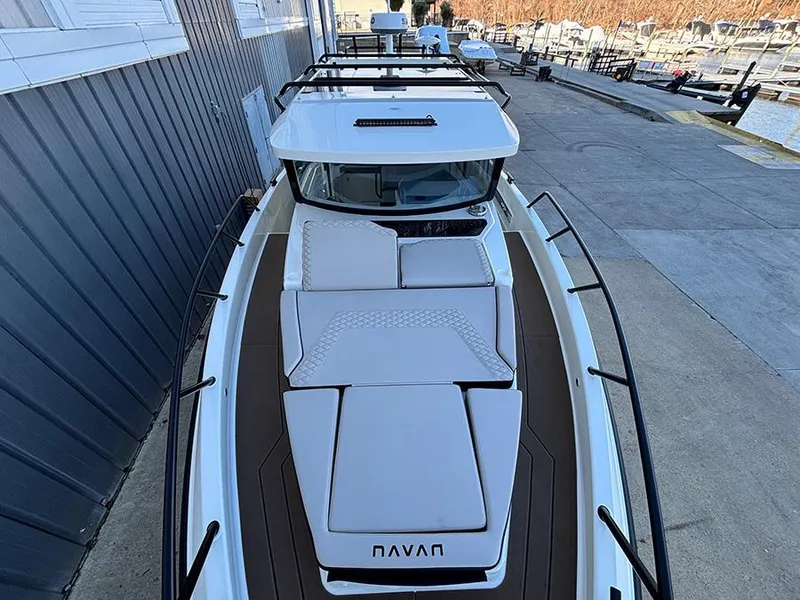 Slide: The Image of 2025 Navan C30 boat docked, featuring sleek design and spacious deck layout. - 42