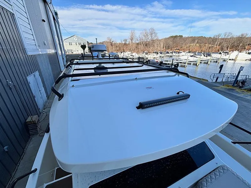 Slide: The Image of 2025 Navan C30 boat docked at marina, showcasing sleek design and modern features. - 44