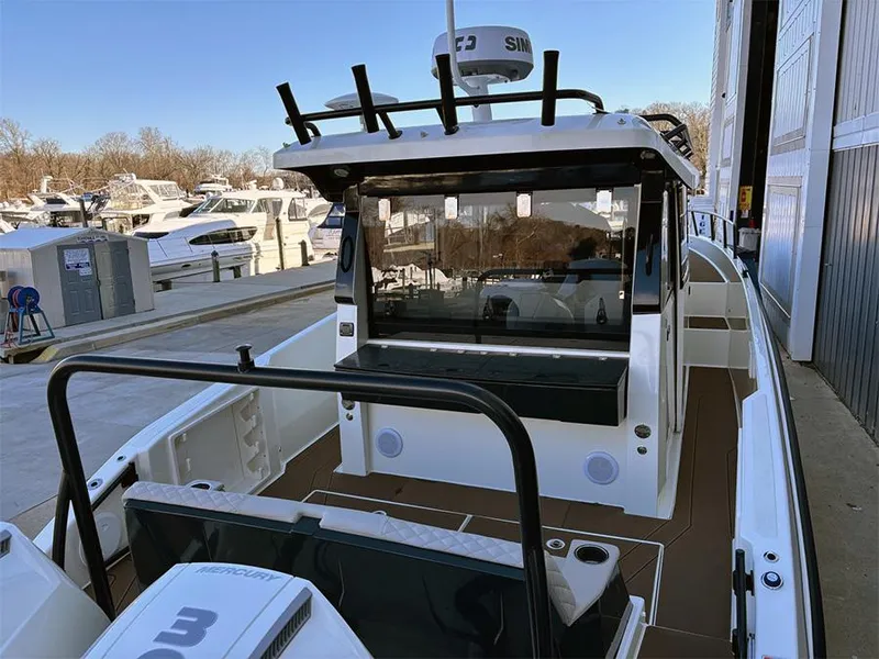 Slide: The Image of 2025 Navan C30 boat docked at marina, showcasing sleek design and modern features. - 5