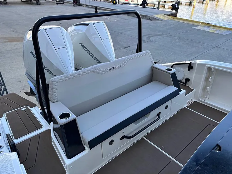 Slide: The Image of 2025 Navan C30 boat with dual Mercury engines, docked at a marina. - 6