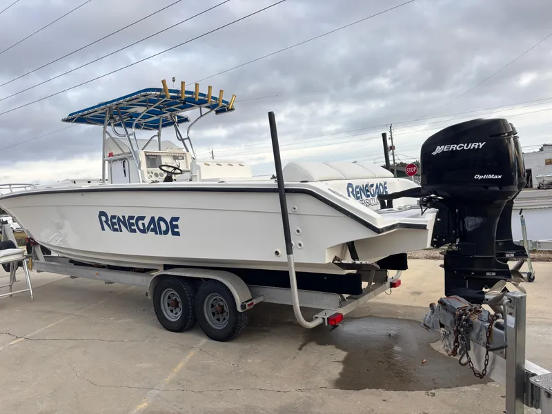 Slide: The Image of 1997 Jefferson Marlago 35 FS boat on trailer with Mercury engine, labeled "Renegade." - 1