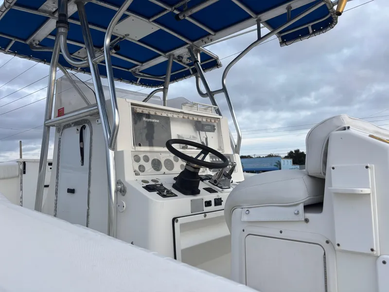 Slide: The Image of 1997 Jefferson Marlago 35 FS boat cockpit with steering wheel and navigation equipment. - 20