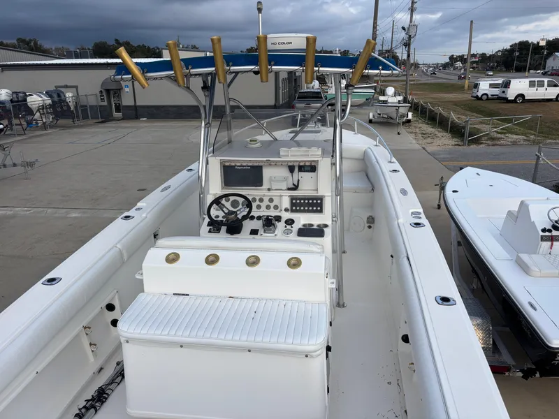 Slide: The Image of 1997 Jefferson Marlago 35 FS boat with center console and fishing rod holders. - 31