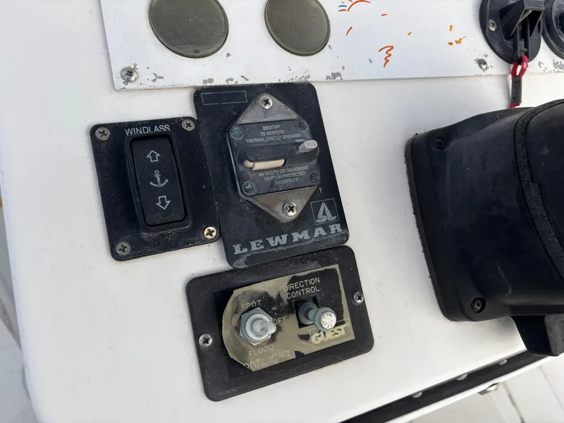 Slide: The Image of Control panel of a 1997 Jefferson Marlago 35 FS boat with Lewmar windlass switch. - 34