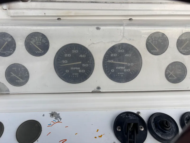 Slide: The Image of Dashboard of a 1997 Jefferson Marlago 35 FS boat with various gauges and controls. - 42