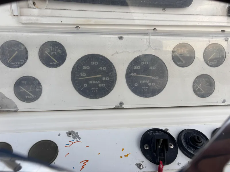 Slide: The Image of Dashboard of a 1997 Jefferson Marlago 35 FS boat with various gauges and controls. - 43