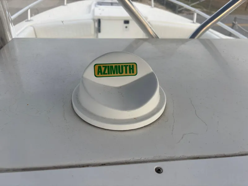 Slide: The Image of Azimuth compass on 1997 Jefferson Marlago 35 FS boat deck. - 48