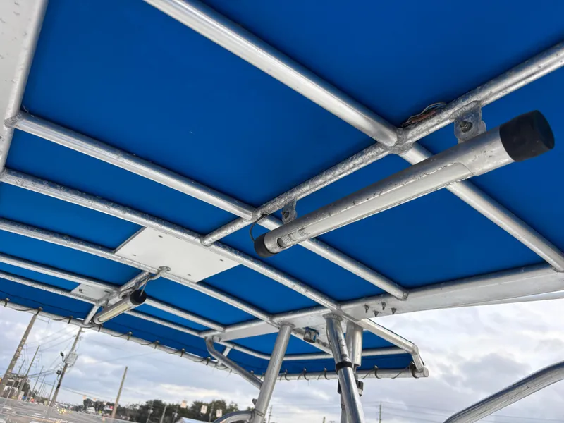 Slide: The Image of Blue canopy and metal frame of 1997 Jefferson Marlago 35 FS boat. - 49