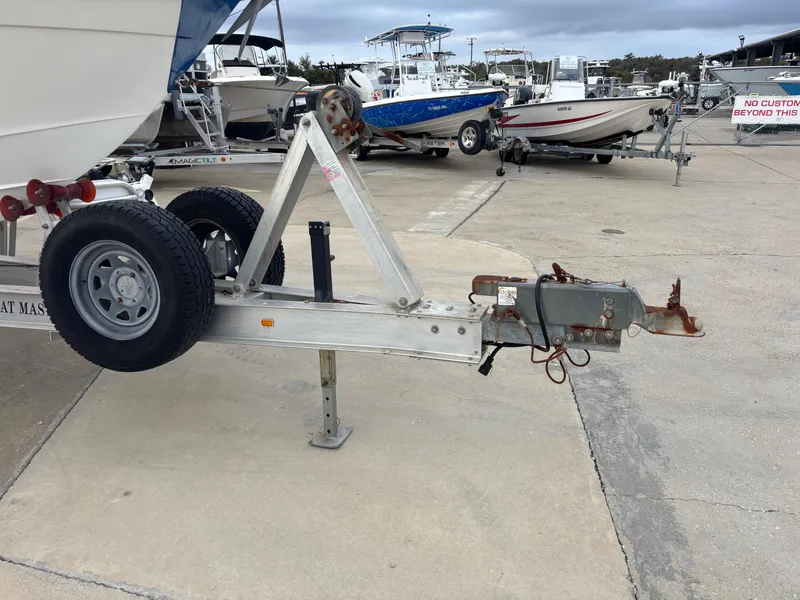 Slide: The Image of Trailer hitch of a 1997 Jefferson Marlago 35 FS boat in a marina setting. - 7