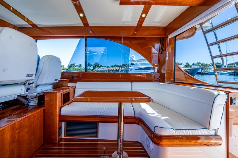 Slide: The Image of Luxurious interior of 2019 Hinckley Talaria 43 Flybridge yacht with elegant wood finish. - 16