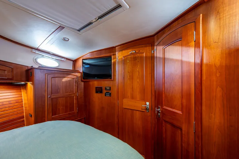 Slide: The Image of Luxurious wood-paneled cabin interior of 2019 Hinckley Talaria 43 Flybridge yacht. - 28