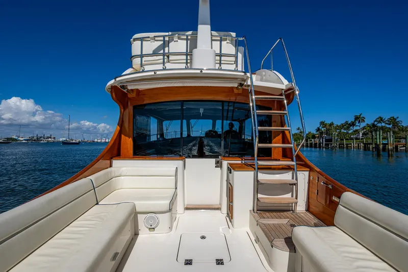 Slide: The Image of 2019 Hinckley Talaria 43 Flybridge yacht with spacious deck and elegant seating. - 8