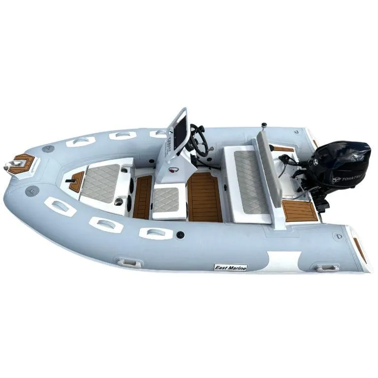 Slide: The Image of 2024 EastMarine Godiac Elite 360 inflatable boat with outboard motor, top view. - 12