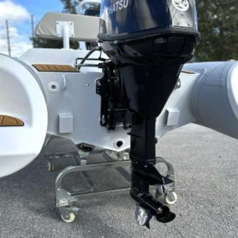 Slide: The Image of 2024 EastMarine Godiac Elite 360 boat with Tohatsu outboard motor on display. - 7