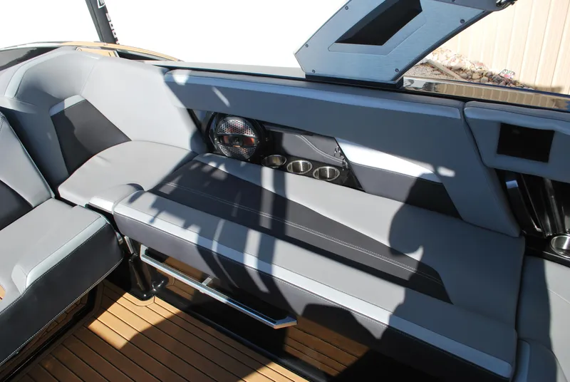 Slide: The Image of 2023 MasterCraft XStar S interior with sleek gray seating and modern design. - 12