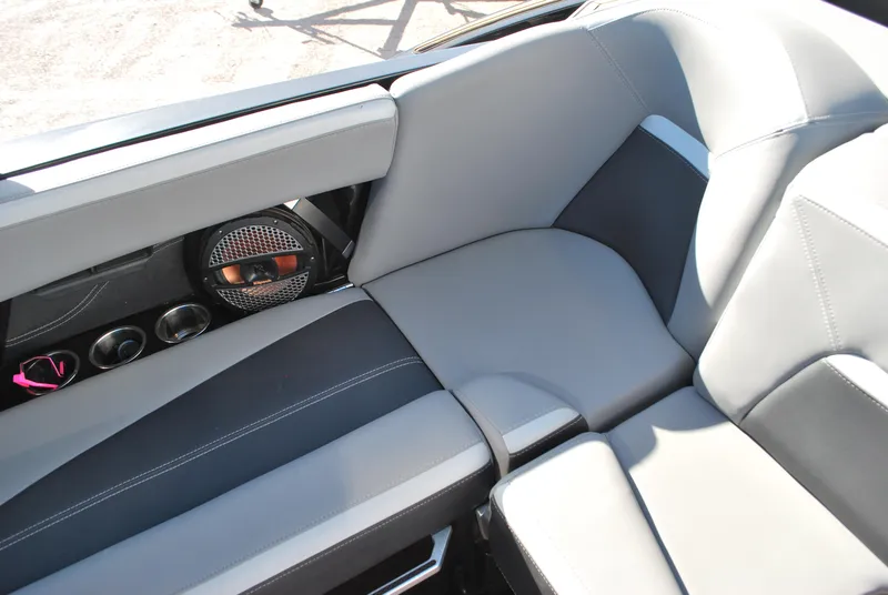 Slide: The Image of 2023 MasterCraft XStar S interior seating with premium upholstery and built-in speakers. - 13