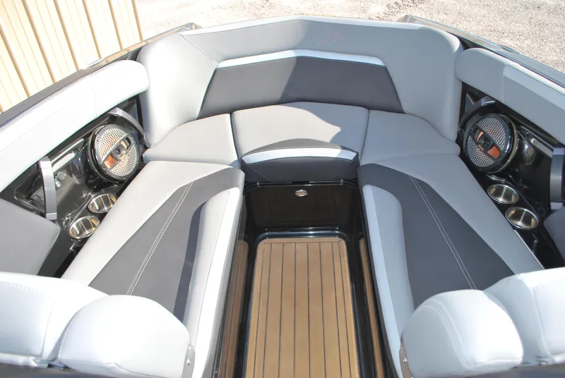Slide: The Image of 2023 MasterCraft XStar S interior with gray seating and premium audio system. - 4