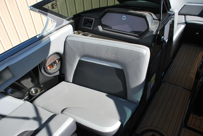 Slide: The Image of 2023 MasterCraft XStar S interior with gray seating and modern dashboard design. - 7