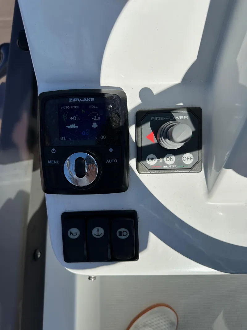 Slide: The Image of Control panel of 2021 Jeanneau NC 1095 Fly boat with navigation and thruster controls. - 16