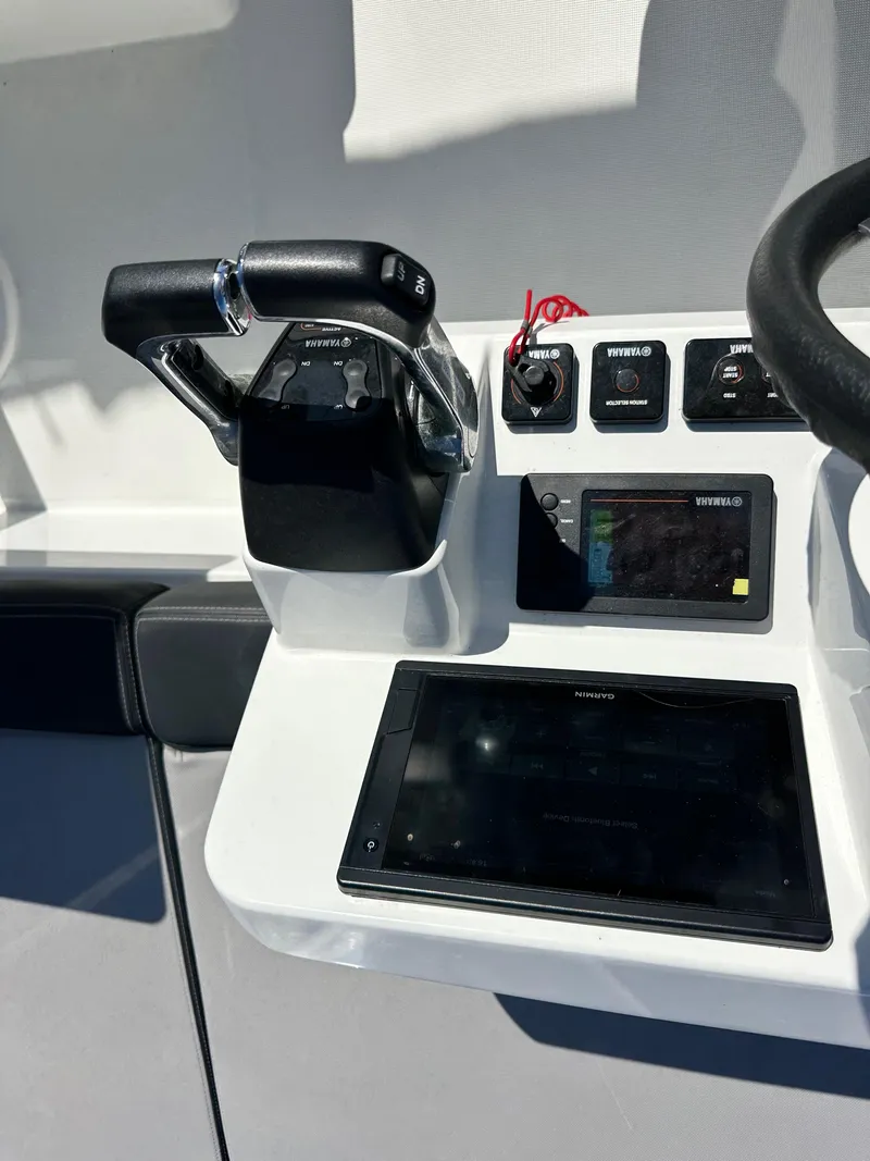 Slide: The Image of 2021 Jeanneau NC 1095 Fly helm with controls and navigation display. - 17