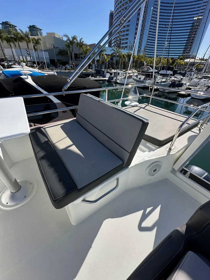 Slide: The Image of 2021 Jeanneau NC 1095 Fly yacht with seating area, docked in a marina. - 20