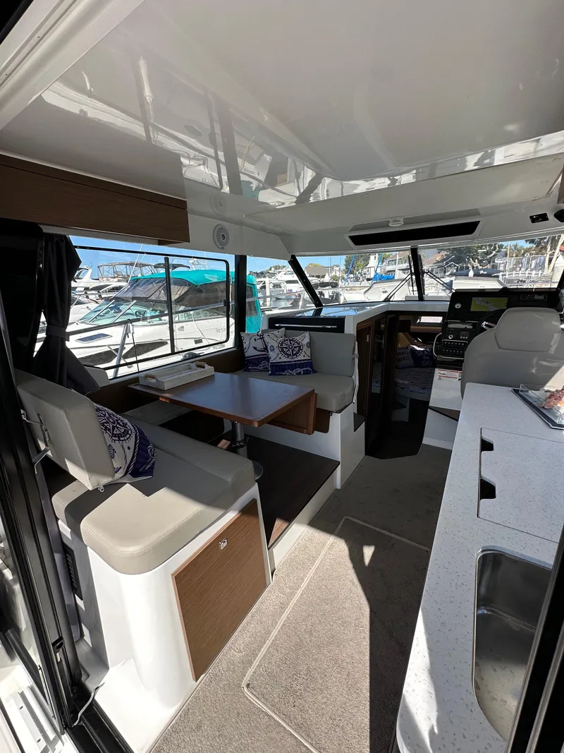 Slide: The Image of Interior of 2021 Jeanneau NC 1095 Fly boat with seating and helm. - 37