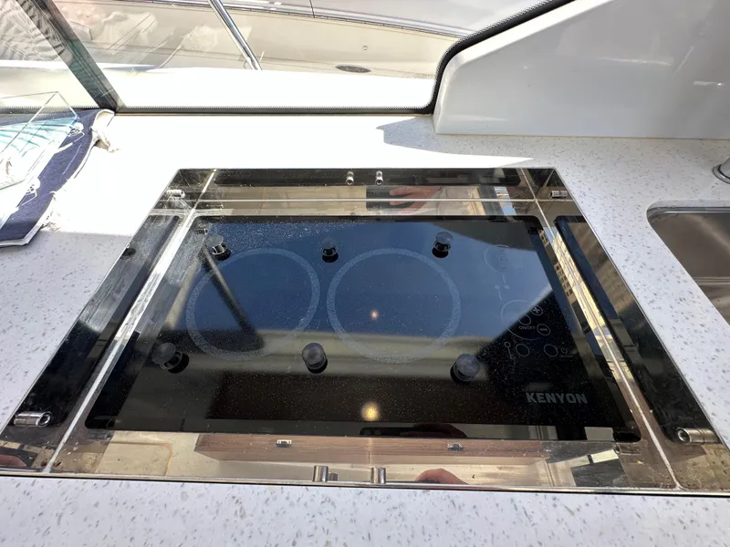 Slide: The Image of Modern stovetop on 2021 Jeanneau NC 1095 Fly yacht kitchen. - 44