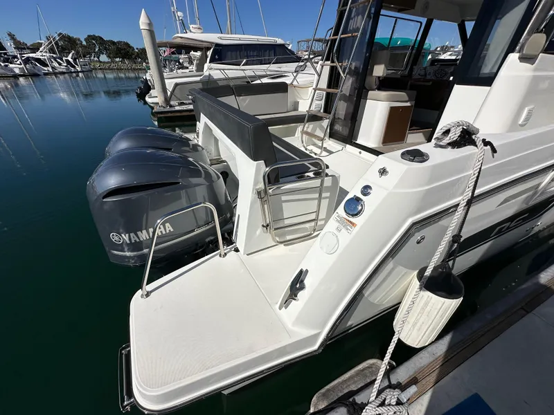 Slide: The Image of 2021 Jeanneau NC 1095 Fly with Yamaha engines docked at marina. - 9