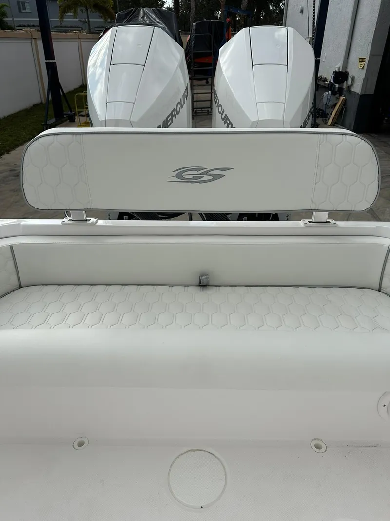 Slide: The Image of 2025 Glasstream 28 Pro boat with dual Mercury engines, featuring white cushioned seating. - 10