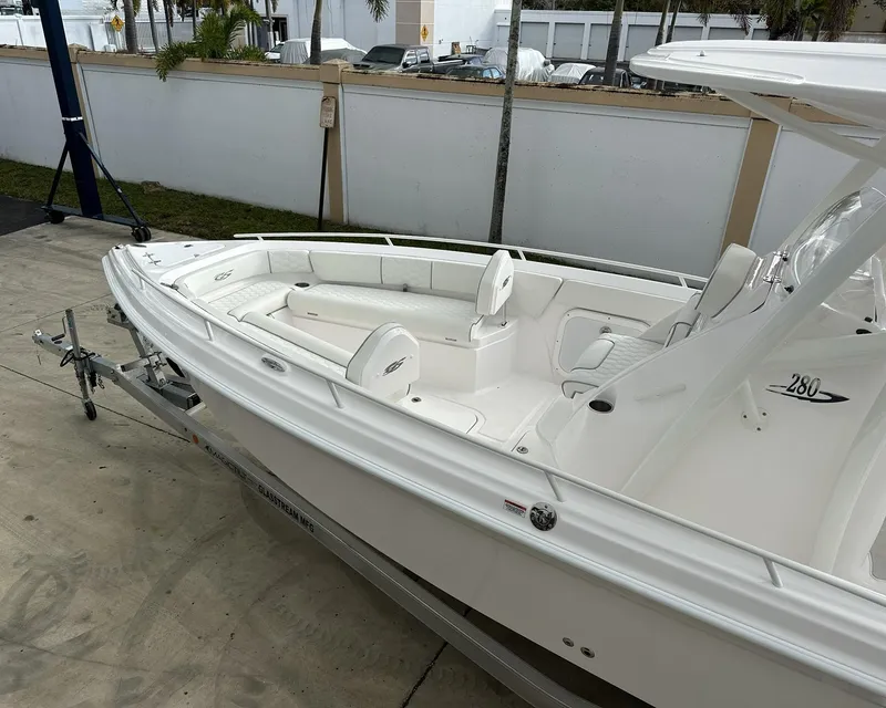 Slide: The Image of 2025 Glasstream 28 Pro boat, white exterior, docked on a trailer. - 6
