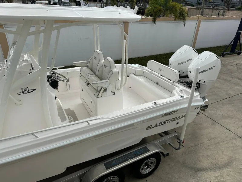 Slide: The Image of 2025 Glasstream 28 Pro boat with dual Mercury engines on a trailer. - 7