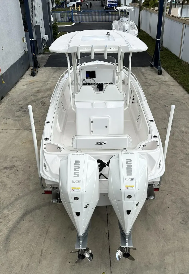 Slide: The Image of 2025 Glasstream 28 Pro boat with dual outboard engines, viewed from the rear. - 8
