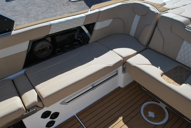 Slide: The Image of Luxurious seating on 2025 MasterCraft XT25 boat with premium upholstery and teak flooring. - 11