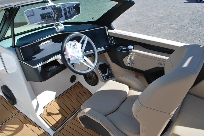 Slide: The Image of Interior of 2025 MasterCraft XT25 boat with modern dashboard and seating. - 7