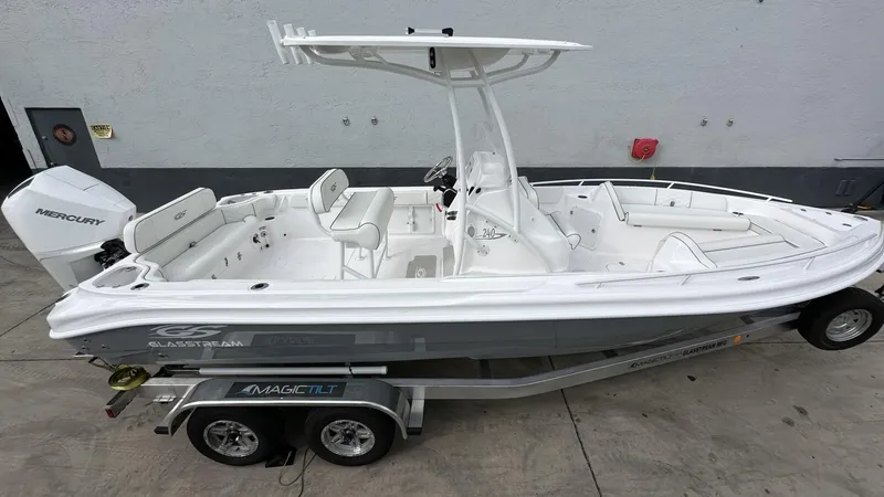 The Image of 2025 Glasstream 240 CCX boat on trailer, featuring sleek design and spacious seating. - 1