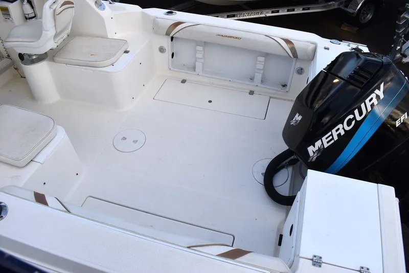 Slide: The Image of 2001 Aquasport 215 Explorer Walk-around boat deck with Mercury engine, spacious seating, and storage. - 11