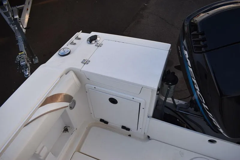 Slide: The Image of 2001 Aquasport 215 Explorer Walk-around boat deck with storage and Mercury engine. - 17