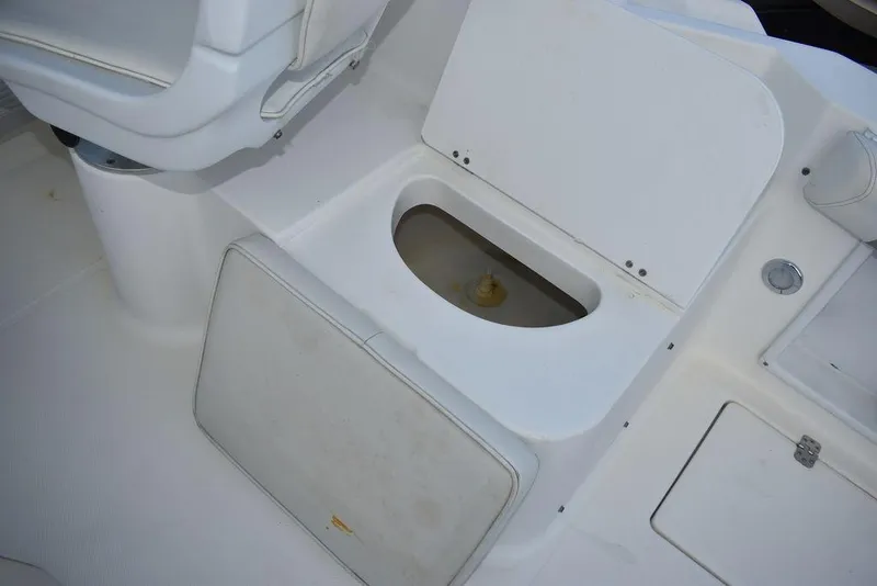 Slide: The Image of 2001 Aquasport 215 Explorer Walk-around boat interior storage compartment. - 25