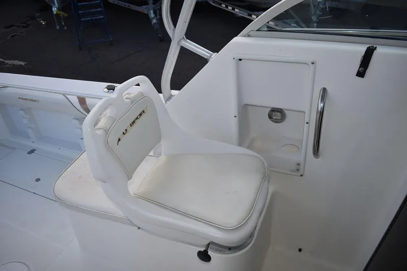 Slide: The Image of 2001 Aquasport 215 Explorer Walk-around boat seat and interior detail. - 35