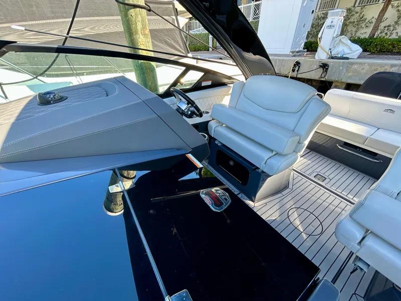 Slide: The Image of 2021 Cruisers Yachts 338 South Beach Edition Bow Rider interior with luxurious seating and sleek design. - 19