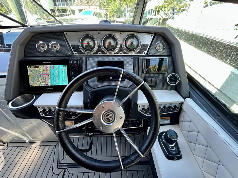 Slide: The Image of 2021 Cruisers Yachts 338 South Beach Edition Bow Rider dashboard with modern navigation and controls. - 23