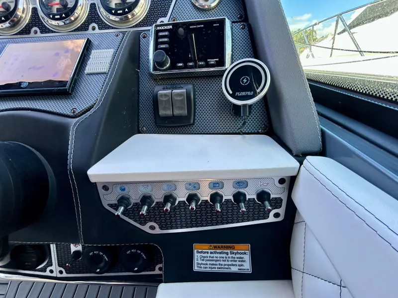 Slide: The Image of 2021 Cruisers Yachts 338 South Beach Edition Bow Rider dashboard with controls and gauges. - 26