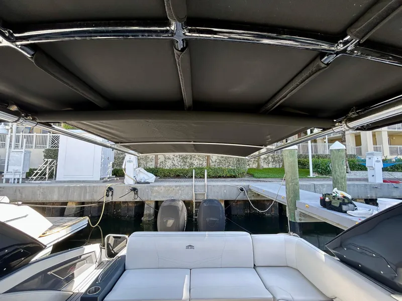 Slide: The Image of 2021 Cruisers Yachts 338 South Beach Edition Bow Rider interior with canopy and seating. - 39