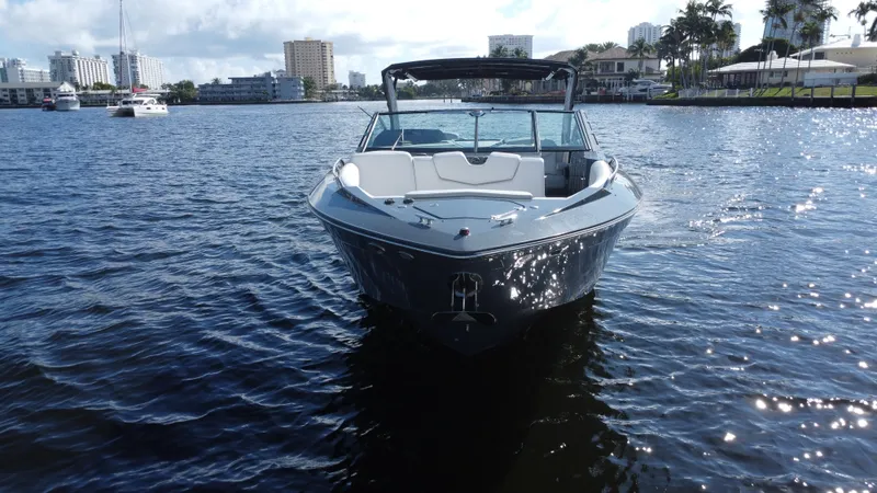 Slide: The Image of 2021 Cruisers Yachts 338 South Beach Edition Bow Rider on water, cityscape background. - 6