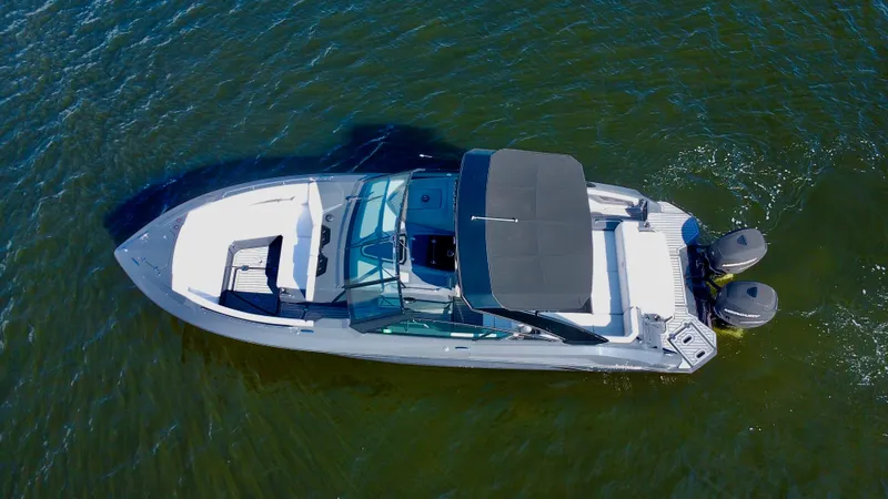 Slide: The Image of 2021 Cruisers Yachts 338 South Beach Edition Bow Rider on water, aerial view. - 9
