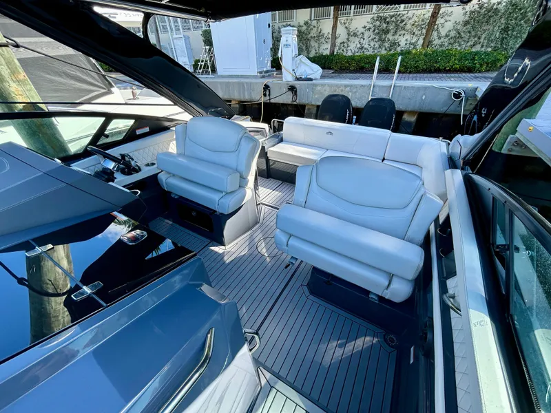 Slide: The Image of 2021 Cruisers Yachts 338 South Beach Edition Bow Rider interior with luxurious seating and sleek design. - 29