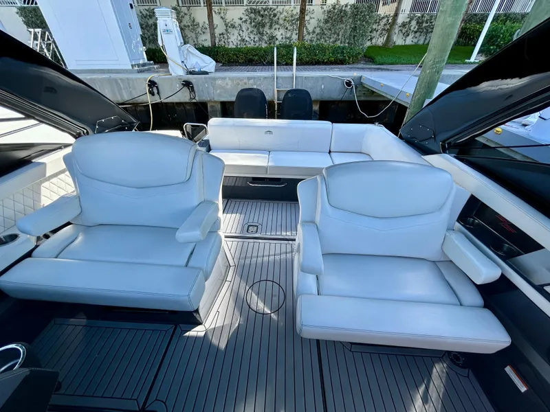 Slide: The Image of 2021 Cruisers Yachts 338 South Beach Edition Bow Rider interior with luxurious white seating. - 31